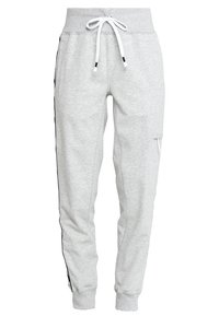 Grijze katoenen sweatpants met een elastische tailleband, witte trekkoord, zijzakken en zwarte zijkanten. Getailleerd ontwerp.