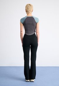 Nike Sportswear Tracksuit bottoms - black