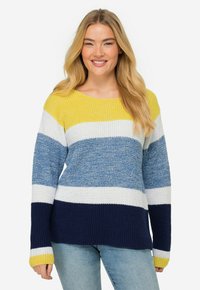 Stickad tröja med horisontella ränder i gult, vitt, blått och marinblått. Vid halsringning och långa ärmar med ribbade muddarna.