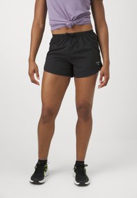 Black athletic shorts with an elastic waistband and drawstring. Lightweight fabric, mid-thigh length, featuring a white logo detail.