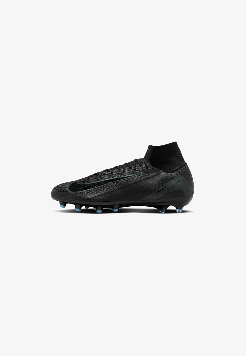 Black soccer cleat with textured upper, sock-like collar, and a distinct green accent. Features conical studs for traction on grass.