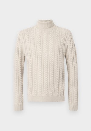 Beige, strikket genser med høy, ribbestrikket turtleneck. Har et strukturert mønster med kabel og ribbestrikkede mansjetter og kant, som gir et koselig utseende.