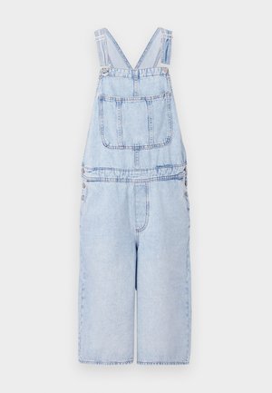 Light blue denim overalls with a relaxed fit, wide legs, adjustable shoulder straps, and front patch pockets. Includes metal snap fasteners.