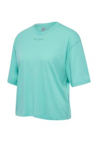 Light turquoise short-sleeve loose-fit crew neck T-shirt with subtle textured fabric and small embroidered logo at the center chest.