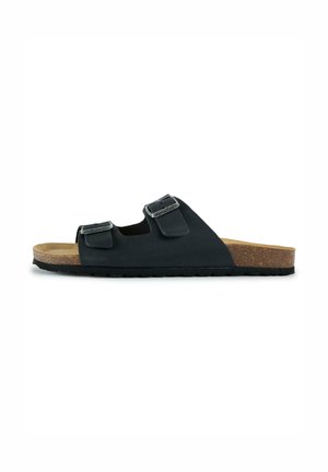 Black slip-on sandal with two adjustable buckled straps and a cork footbed on a black sole, shown from the side.