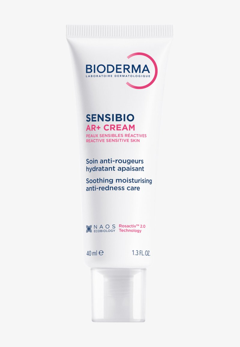 Crème Bioderma Sensibio AR+ dans un tube blanc de 40 ml, texture lisse, avec texte bleu et rose, logo NAOS, et un bouchon à clapet transparent.