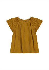 Top giallo senape con maniche corte e larghe. Il busto presenta un tessuto texture; le maniche hanno dettagli in broderie anglaise. Scollatura arrotondata.