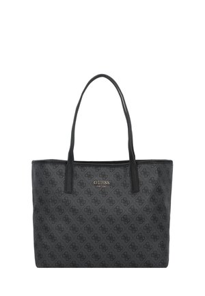 Sort Guess shopper taske med mønstret logo print og dobbelte skulderstropper, rektangulær form og metal logo plaque foran.
