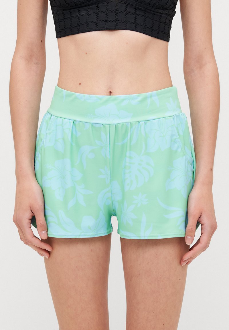 Mint green shorts with a floral pattern in lighter shades, elastic waistband, and a lightweight, smooth fabric.