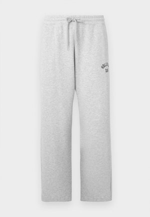 Lys grå joggebukser med elastisk midje, snøring, sidelommer og liten "Hollister Surf" logo på øvre venstre lår.
