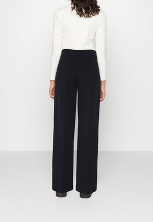 Spodnie materiałowe