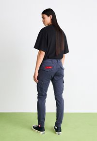 Alpha Industries PETROL PATCH - Cargo trousers - ultra navy