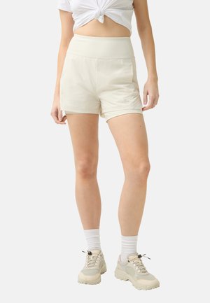 Cremefarbene Sportshorts mit hohem Bund, glatter Textur und Seitentaschen. Auffälliges Logo auf der Vorderseite.