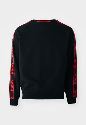 Black sweatshirt made of soft fabric with red logo tape down the sleeves; features a crewneck and ribbed cuffs and hem.