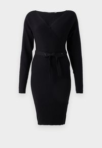 Svart ribbad stickad klänning med v-ringad halsringning, långa ärmar och ett knytskärp i midjan. Kroppsnära silhuett, slät textur med subtila detaljer.