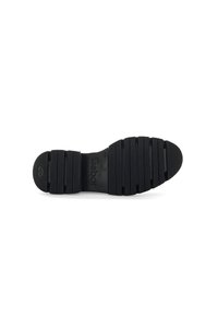 Suela de zapato de goma negra con surcos segmentados para tracción, con el nombre de la marca "Gabor" en relieve y un diseño de punta redondeada.