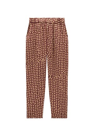 Brązowe spodnie w kremowy wzór kropeczek, z elastycznym pasem, zwężanymi nogawkami i miękką fakturą. Brak widocznych kieszeni.
