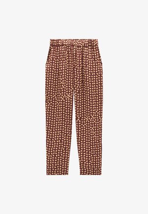 Brązowe spodnie w kremowy wzór kropeczek, z elastycznym pasem, zwężanymi nogawkami i miękką fakturą. Brak widocznych kieszeni.
