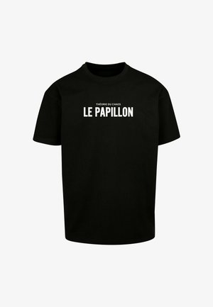 Fekete pamut póló kerek nyakkal, rövid ujjal, amelynek közepén fehér nyomtatott felirat található: "THÉORIE DU CHAOS LE PAPILLON".