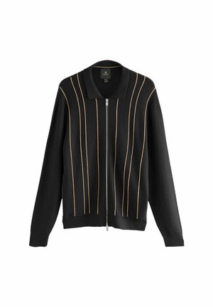 Cárdigan negro de punto con cremallera frontal, con acentos dorados verticales y un diseño de cuello clásico. Textura suave, ajuste relajado.