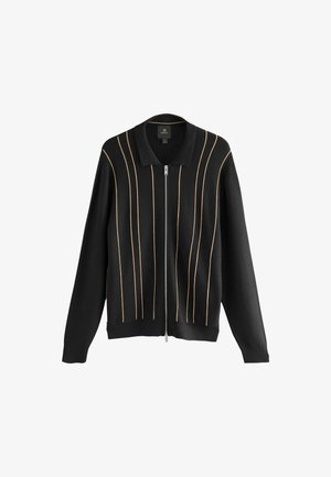 Black knitted cardigan with a zip front, featuring vertical gold accents and a classic collar design. Soft texture, relaxed fit.