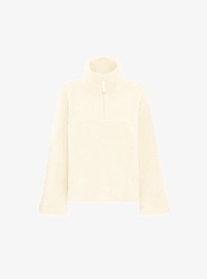 Off-white fleece pullover med en kort lynlås, høj krave og lange ærmer. Blød tekstur og afslappet pasform, velegnet til hverdagstøj.