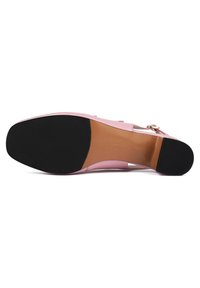 Pink high heel shoe with a smooth leather upper, featuring a black rubber sole and a slender strap with a gold-tone buckle detail.
