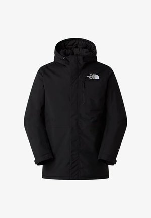 Giacca impermeabile nera con cappuccio, tasca sul petto con cerniera e logo sul lato superiore sinistro. Presenta una finitura liscia e opaca.