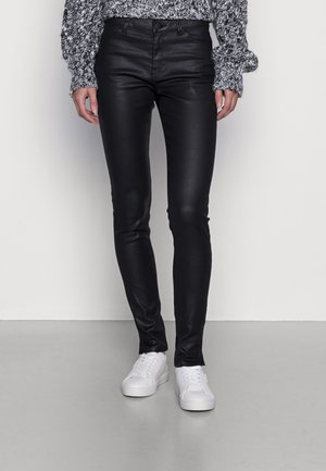 COATED - Trousers - black