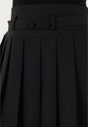 Black pleated skirt featuring a smooth texture, a fitted waistband with two circular buttons, and a matching fabric belt detail.
