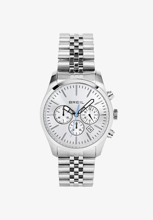 Sølv rustfrit stål ur med en rund urskive, tre underdials, en datovisning og et tekstureret lenkearmbånd. Blå accenter på viserne.