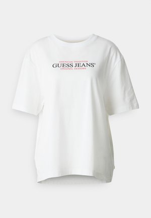 White cotton T-shirt with a crew neckline, short sleeves, and a relaxed fit. Features black and red "GUESS JEANS" logo text on the front.