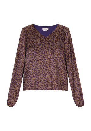 Pikad varrukad, lillakate krenni V-kaelusega; omab kuldset lillemotiivi üle kogu pinna ja on vabalt voolav koos elastsete mansettidega.