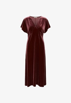 Burgundy velvet dress with short sleeves, V-neckline, and long flowing skirt, designed for a relaxed fit.