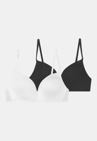 Deux soutien-gorge sans couture en noir et blanc, dotés de bretelles ajustables et de bonnets moulés. Tissu lisse avec un design classique.
