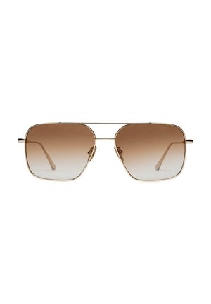 Aviator-stil solbriller med brune gradientlinser, tynne gylne metallrammer og rette stenger. Minimalistisk design og glatt finish.