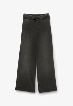 Schwarze Weithose mit elastischem Bund und Kordelzug, ausgestattet mit Seitentaschen und legerem Schnitt.