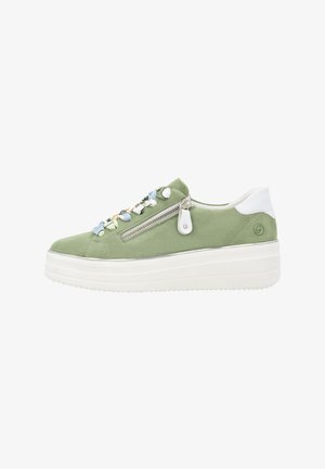 Green suede sneaker with white accents, a zip closure on the side, and decorative flower appliqués along the laces. Chunky platform sole.