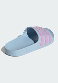Light blue slide sandal featuring a textured material, an open toe, and three pink stripes on the upper side with brand logo on the side.