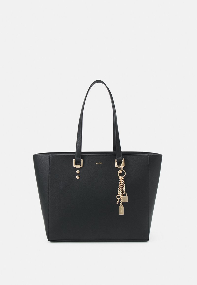 Sac fourre-tout noir avec une surface texturée, accents en matériel doré et une chaîne décorative avec des charms. Comprend deux poignées solides pour l'épaule.