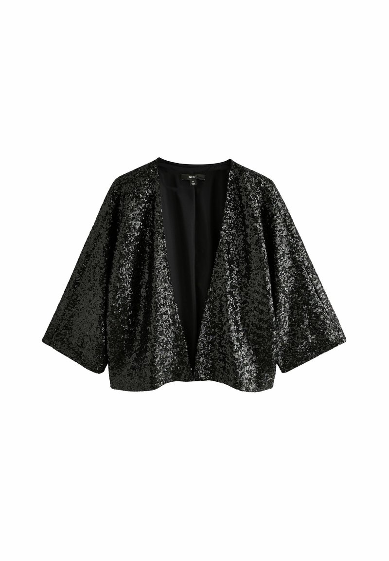 Veste noire à sequins ouverte sur le devant, manches larges trois-quarts, coupe ample et sans fermetures visibles, présentée sur fond blanc uni.