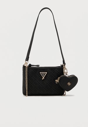Black quilted Guess crossbody bag with gold chain strap and attached black heart-shaped coin purse with gold accents.