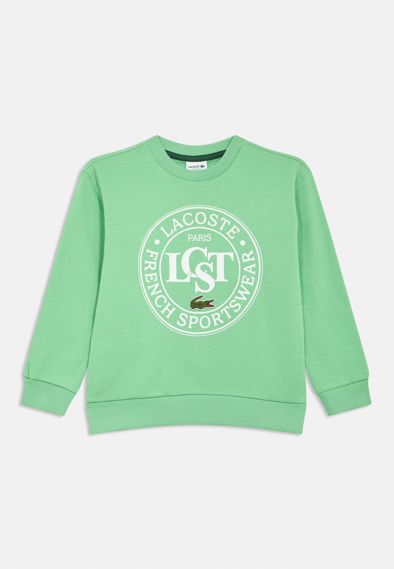 Zelená bavlnená mikina s okrúhlym bielym logom s nápisom "LACOSTE PARIS FRENCH SPORTSWEAR" a malým vyšívaným dizajnom krokodíla.