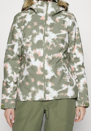 Camouflage-patterned softshell jacket in green, white, and pink. Features a zip closure, hood with faux fur trim, and zippered side pockets.