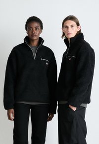 Tommy Jeans BADGE ZIP UNISEX - Flisinis džemperis - black