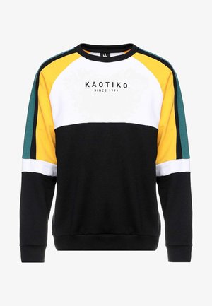 Bluza z blokami kolorów: czarnego, białego, żółtego i zielonego, z napisem "KAOTIKO SINCE 1999" na środku z przodu.