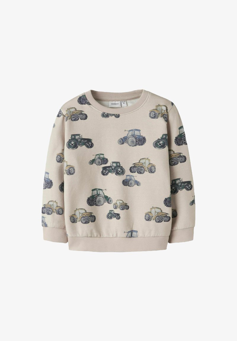 Beige sweatshirt met verspreide tractorprints in groen, blauw en zwart. Ronde hals, ribgebreide manchetten en zoom. Zachte stoftextuur.