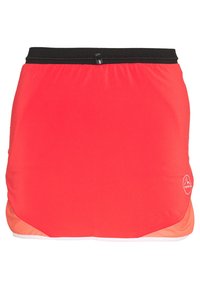 Roter Sportrock mit schwarzem elastischem Bund, kleiner Reißverschlusstasche und Logo auf der unteren rechten Seite.