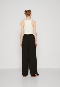 Vero Moda Tall VMALVA WIDE - Trousers - black
