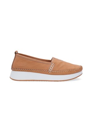 Tan leather slip-on shoes with white rubber sole, featuring stitched detailing and a rounded toe. Smooth texture with minimal accents.